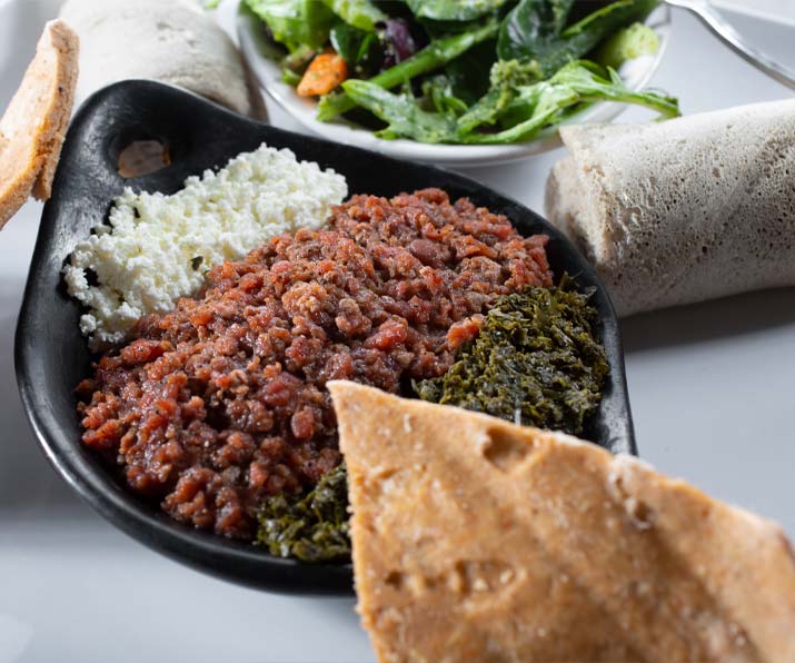 Kitfo Ethiopian steak tartar made with minced beef and spiced butter at Red Sea Restaurant in Oakland Park, Florida